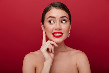 Confused woman with bright red lipstick