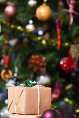 Gift wrapped christmas presents under the decorated christmas tree in cosy family home interior