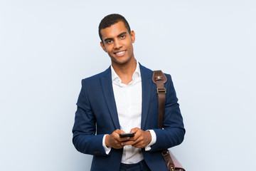 Businessman over isolated blue background