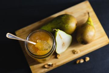 Fresh pear jam on the dark table