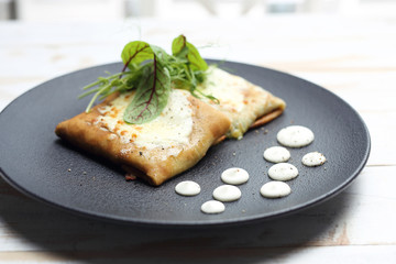 Pancakes with vegetable stuffing, appetizing dish. Stuffed pancakes