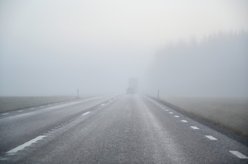 slippery morning road with poor wiew in november