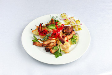 Fried potatoes with lard, bell pepper, parsley, dill and pickled cucumber.