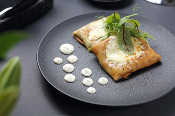 Pancakes with vegetable stuffing, appetizing dish. Stuffed pancakes