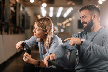 Happy young couple. Couple playing video game. 
