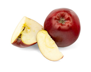 Red apples with apple slice and leaf isolated on a white background.