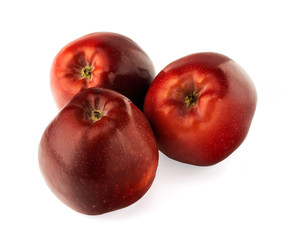 Red apples with apple slice and leaf isolated on a white background.