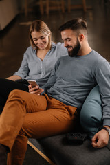 Fototapeta premium Young happy couple. Boyfriend and girlfriend having fun.