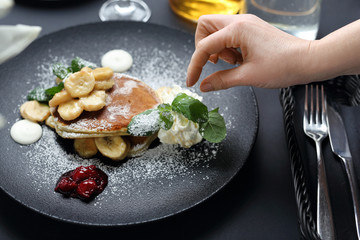 Cooking. The chef decorates the plate. Serving and decorating the dish.