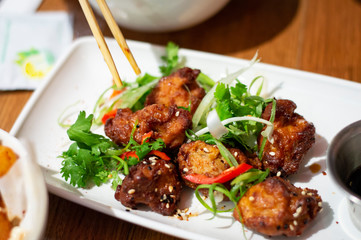 Japanese Karaage Chicken in White Plate. Authentic Shot from Restaurant