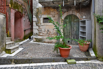 Fornelli, 11/23/2019. A narrow street among the old houses of a mountain village in the Molise...