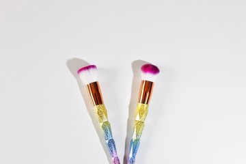 paintbrushes in glass isolated on white background
