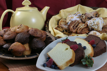 Fototapeta na wymiar muffins, scones tea breads with raspberry and tea close up