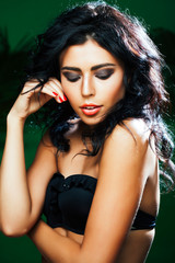 Fototapeta premium young pretty brunette woman on green background smiling happy, lifestyle peope concept