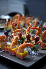 Beautifully decorated catering banquet table with different food snacks and appetizers on corporate, christmas, birthday, party event or wedding celebration