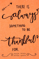 Fototapeta na wymiar There is always something to be thankful for. Hand calligraphy on paper. Design concept.