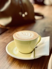 cup of coffee on wooden table