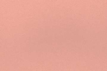 Fashionable coral pink pantone color of spring-summer 2020 season from New York fashion week. Texture of colored porous rubber. Modern luxury background or mock up with space for text