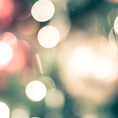 Obraz premium Christmas tree bokeh blur abstract background for merry x'mas party and new year celebration in red green gold color for xmas holiday night light 