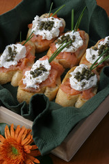 Lox with cream cheese and capers on french bread