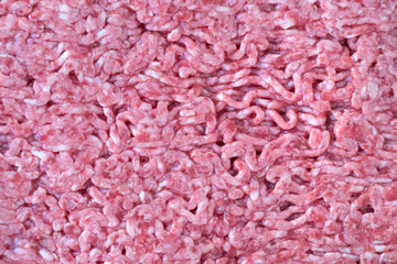 Texture of red mincemeat. Raw food, forcemeat background. Cooking concept.