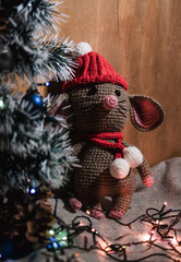  gray knitted mouse in a red cap