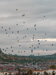 Take-off of many balloons in the early morning. Turkish Cappadocia.