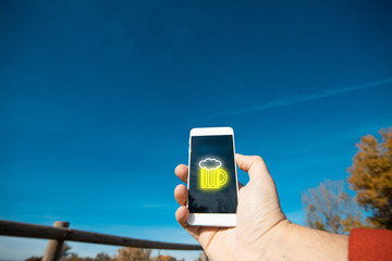 man with mobile phone with beer mug symbol