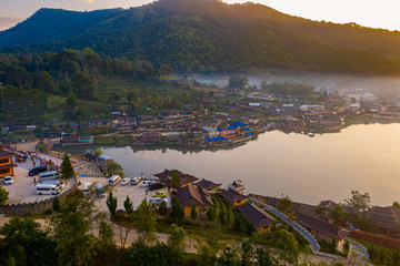 Fototapeta premium Aerial landscape of Ban Rak Thai with sunrise in the morning located in Maehongsan province, Thailand.