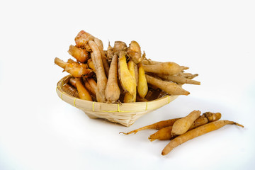 finger root in basket on white background. Chinese ginger, Boesenbergia rotunda, Krachai in a basket.