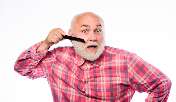 Hairstylist bold head. Man bearded barber handsome hairstylist use tool styling beard. Male haircut. Comb hair. Hairstylist use professional equipment. Barbershop concept. Hairdresser service