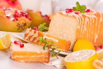 Lemon sponge cake with pomegranate.