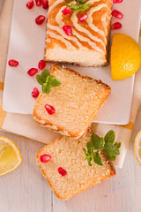 Lemon sponge cake with pomegranate.