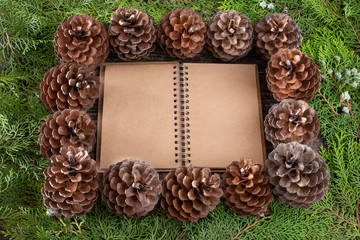 Christmas pine cone garland on the wooden rustic table