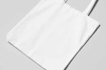 White tote bag mockup on a grey background. - obrazy, fototapety, plakaty