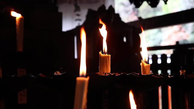 Candles burning in small temple in Kyoto