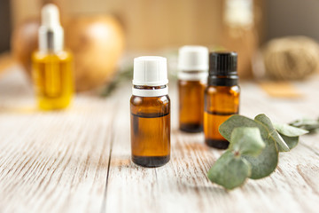 three bottles of essential oil on a white background, horizontal