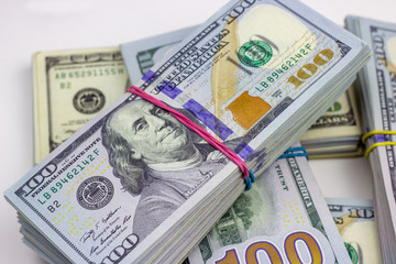 Fototapeta premium American dollar usa packs on money background. Financial concept.