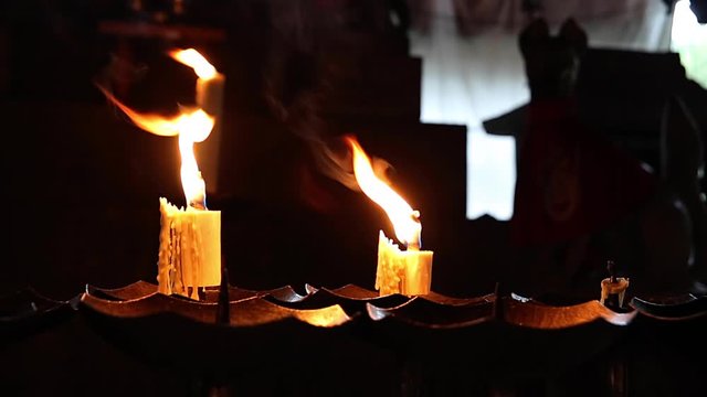 Candles burning in small temple in Kyoto
