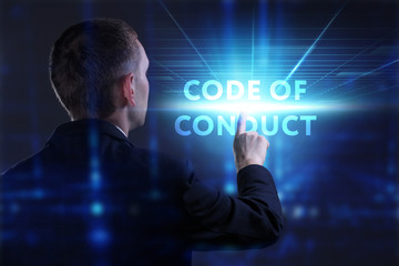 Business, Technology, Internet and network concept. Young businessman working on a virtual screen of the future and sees the inscription: Code of conduct