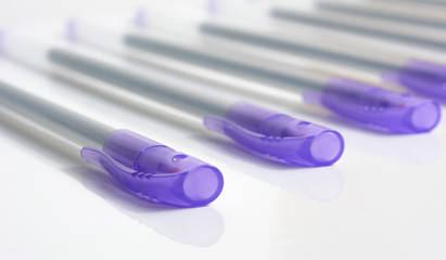 Six Pens on a white background.Line placement.Side view