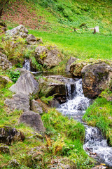 Waterfall, cascade, an artificial watercourse in the form of steps in the mountains of Austria