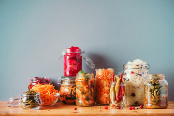 Probiotics food background. Korean carrot, kimchi, beetroot, sauerkraut, pickled cucumbers in glass...