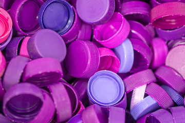 The plastic lid that is left over from the bottles are collected to be recycled into other items for reuse.