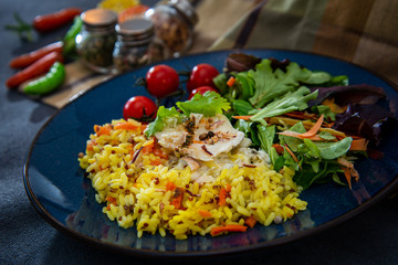 grilled salmon and rice-french cuisine dish with tomato and salmon