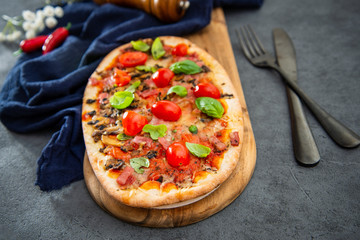 pizza cooked with standard cooked ham and mushrooms