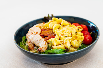 pasta and chicken on the table