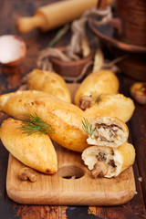 Delicious small savory pies filled with potatoes, champignons mushrooms and onion. 