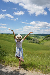 Tourist woman enjoying the fantastic view in Tuscany.