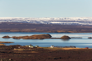 View to the small town and snowy mountains in the Iceland